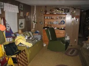 That fish on the wall is not a Billy Bass; furniture is fair game as storage space ’cause it’s easier to find stuff when you can see it