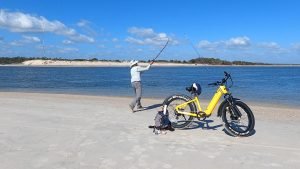 Casting on the beach with ebike nearby